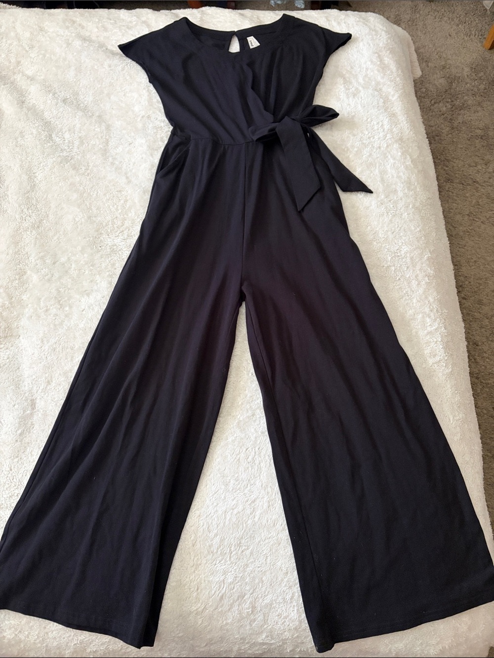 Black, Stretchy Jumpsuit with decorative side tie.